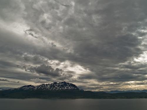 Photo of a Norwegian fjord and mountain photographed from up in the mountains