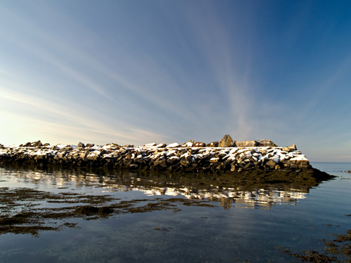 Photo of snowy seawall in the winter