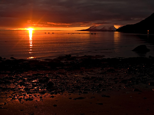 Photo of sunset on the beach at 10 PM