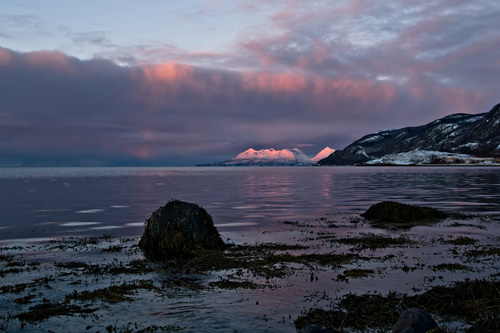 Picture from the coast in the Northern Norway - Alpenglow in the mountains and clouds