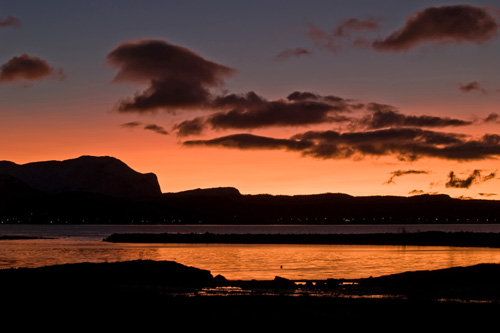 Picture of harbor bathed in evening sunlight in Northern Norway