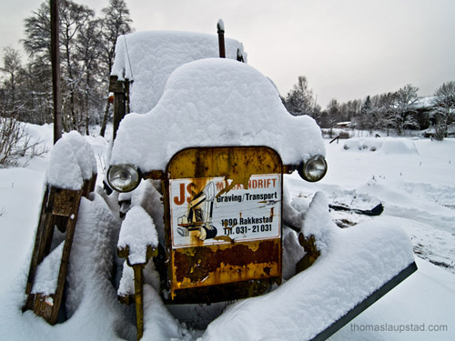 Picture of tractor covered with snow - 40 cm snowfall in one day in Norway