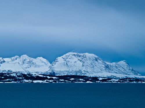 CPicture of Norwegian winter mountain with snow blowing off the peaks